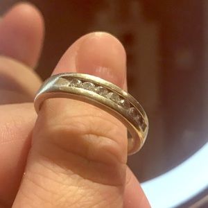 14karat whitegold ring with 7 channel set diamonds